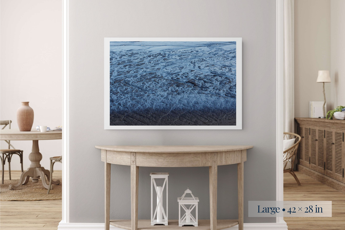 Large: A Labyrinth of Sand and Sea shown as a Large 42 × 28-inch print above a console table.
