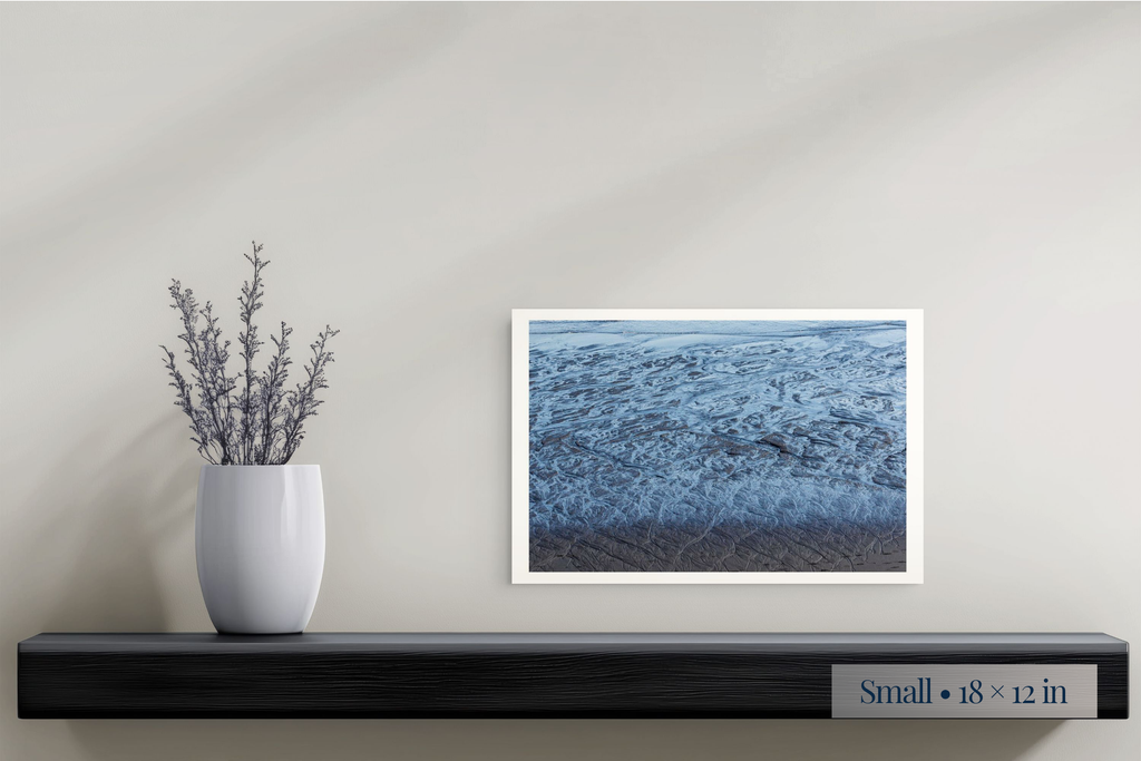 Small: A Labyrinth of Sand and Sea shown as a Small 18 × 12-inch print above a shelf.