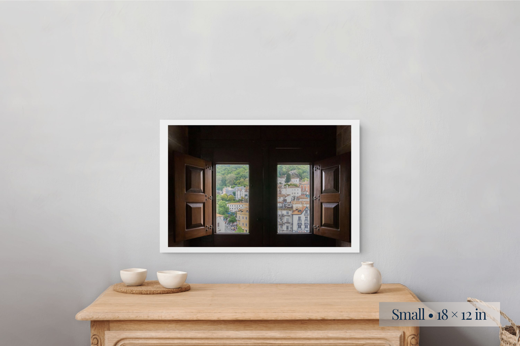 Small: What Will the New Day Bring? shown as a Small 18 × 12-inch print above a nightstand.