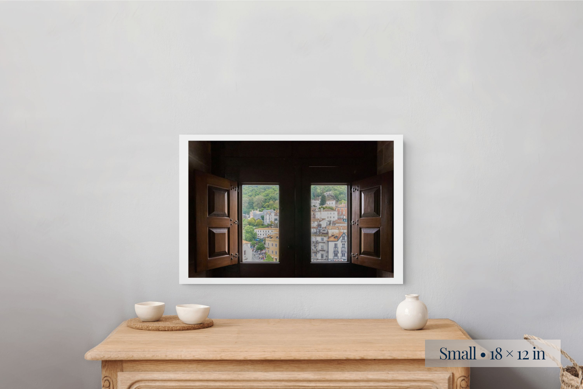 Small: What Will the New Day Bring? shown as a Small 18 × 12-inch print above a nightstand.